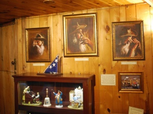 Portraits of Korzcak commissioned by his wife hang above a display of family mementos 
